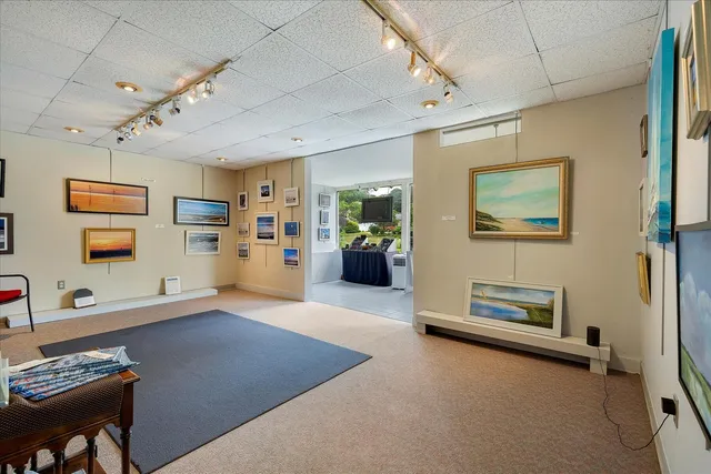 a view of a hallway with furniture