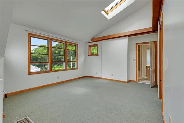 a view of a room with wooden floor and a sink