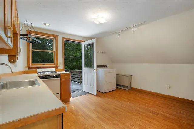 a view of a house with pool and deck