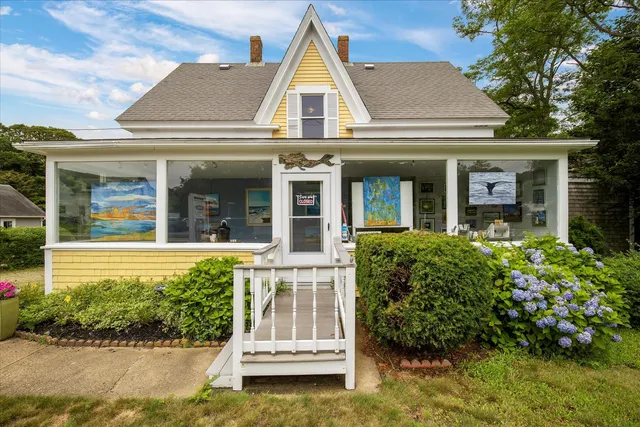 front view of a house with a yard