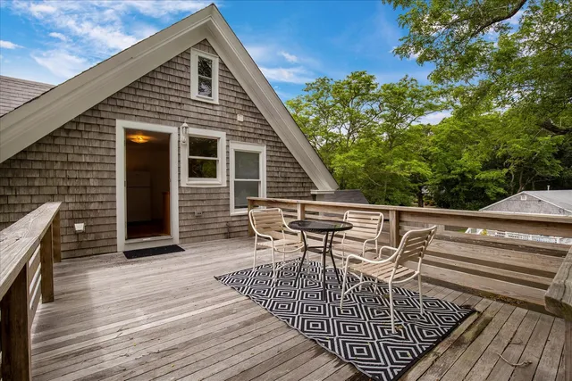a living room with furniture a rug and a fireplace
