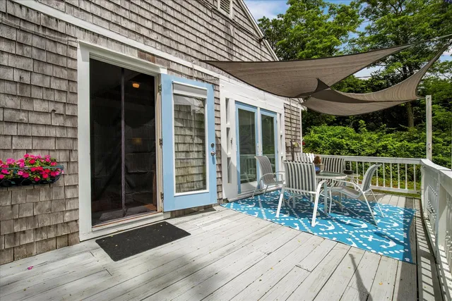 a view of a workspace with furniture and lounge chair