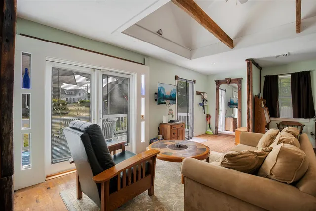 a kitchen with stainless steel appliances granite countertop a refrigerator a stove and a sink