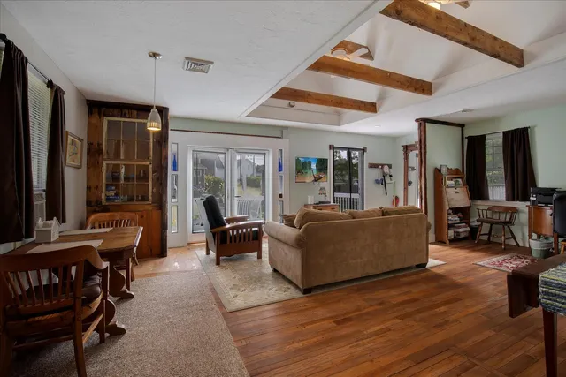 a kitchen with stainless steel appliances granite countertop a refrigerator a stove and a sink