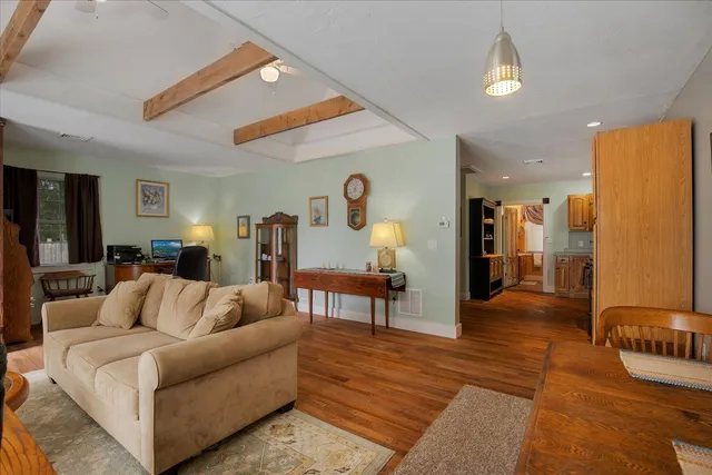 a bedroom with two beds and a chandelier