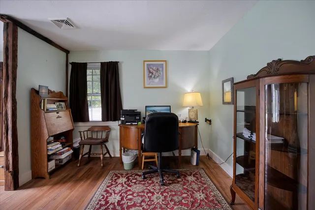a bedroom with two beds and a chandelier