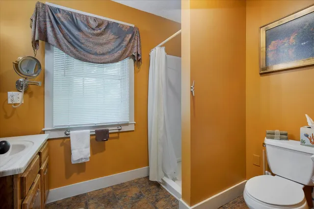 a view of a house with a yard and sitting area