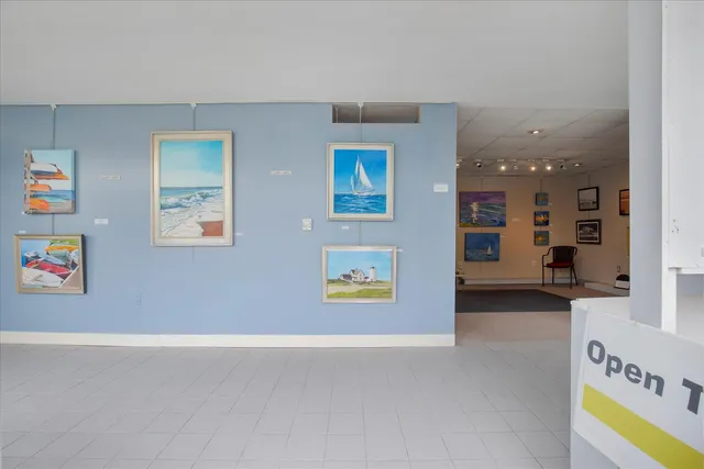 a view of a livingroom with furniture and staircase