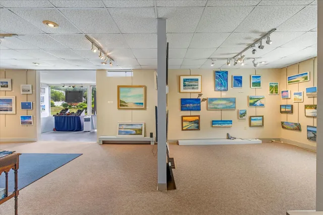 a view of a livingroom with walk in closet and bedroom