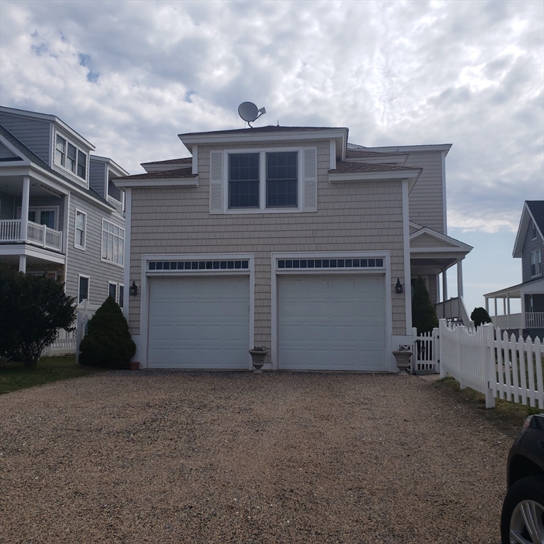 398 North End, Unit B Salisbury, MA 01952 - Photo 13 of 13 a view of a house with a stove and wooden fence