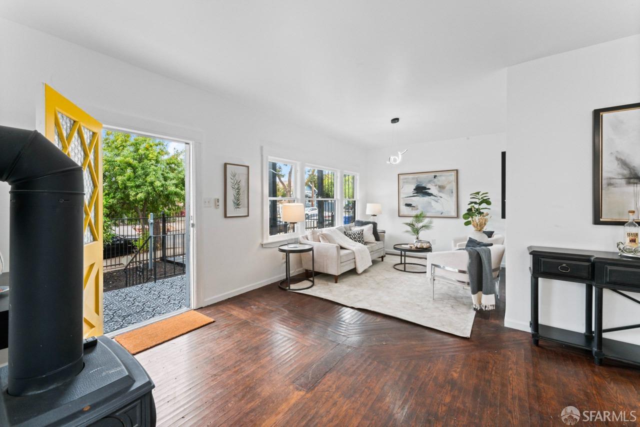 1718 37th Avenue Oakland, CA 94601 - Photo 13 of 33 a living room with furniture and a wooden floor