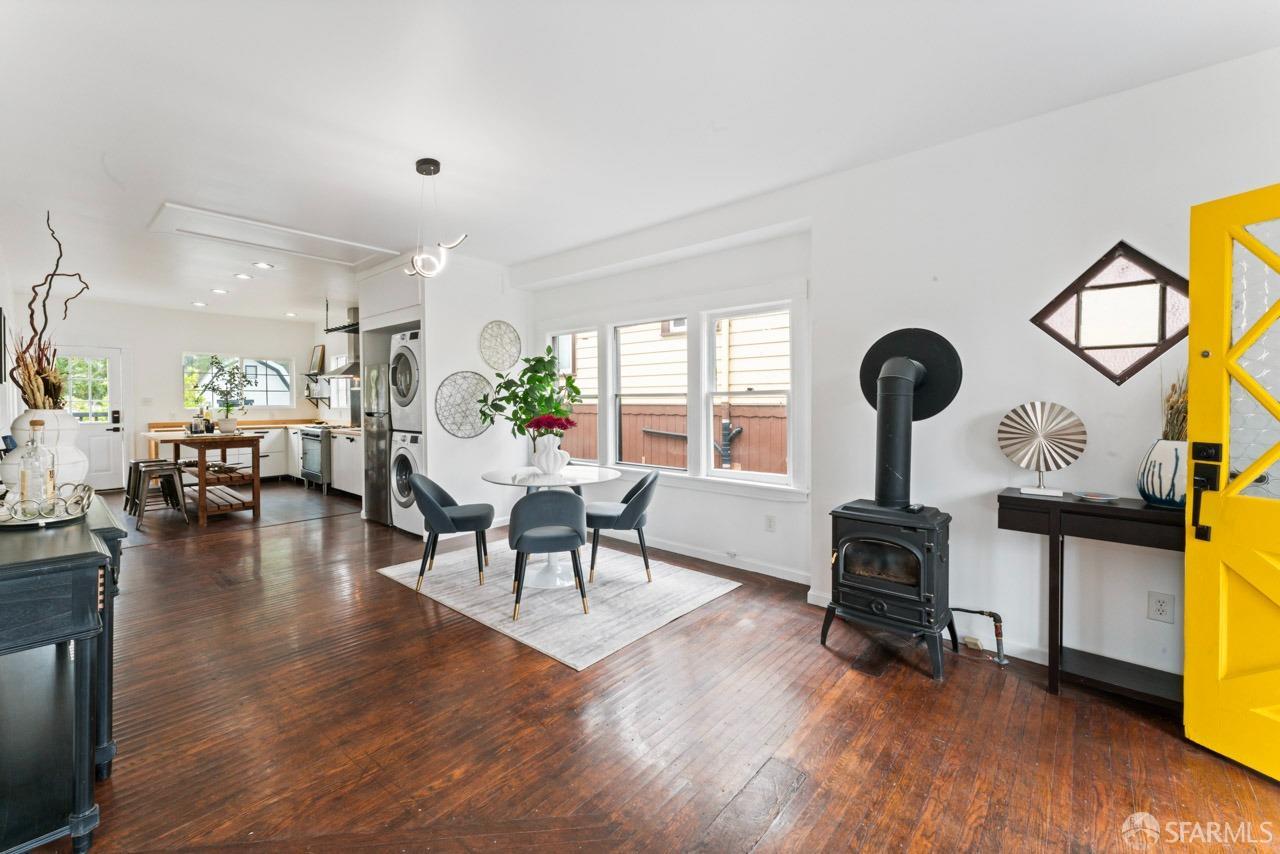 1718 37th Avenue Oakland, CA 94601 - Photo 14 of 33 a living room with furniture and a floor to ceiling window
