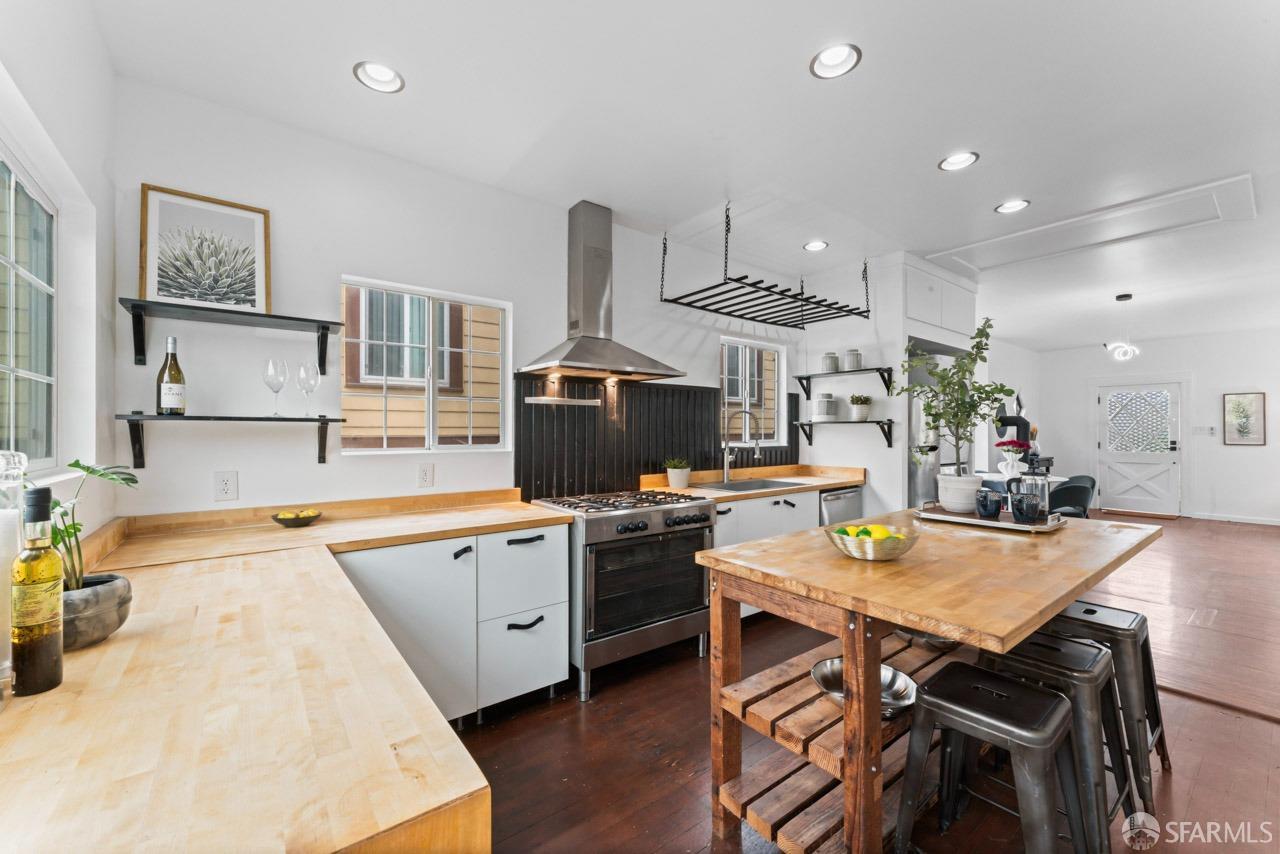 1718 37th Avenue Oakland, CA 94601 - Photo 18 of 33 a kitchen with a table and chairs in it