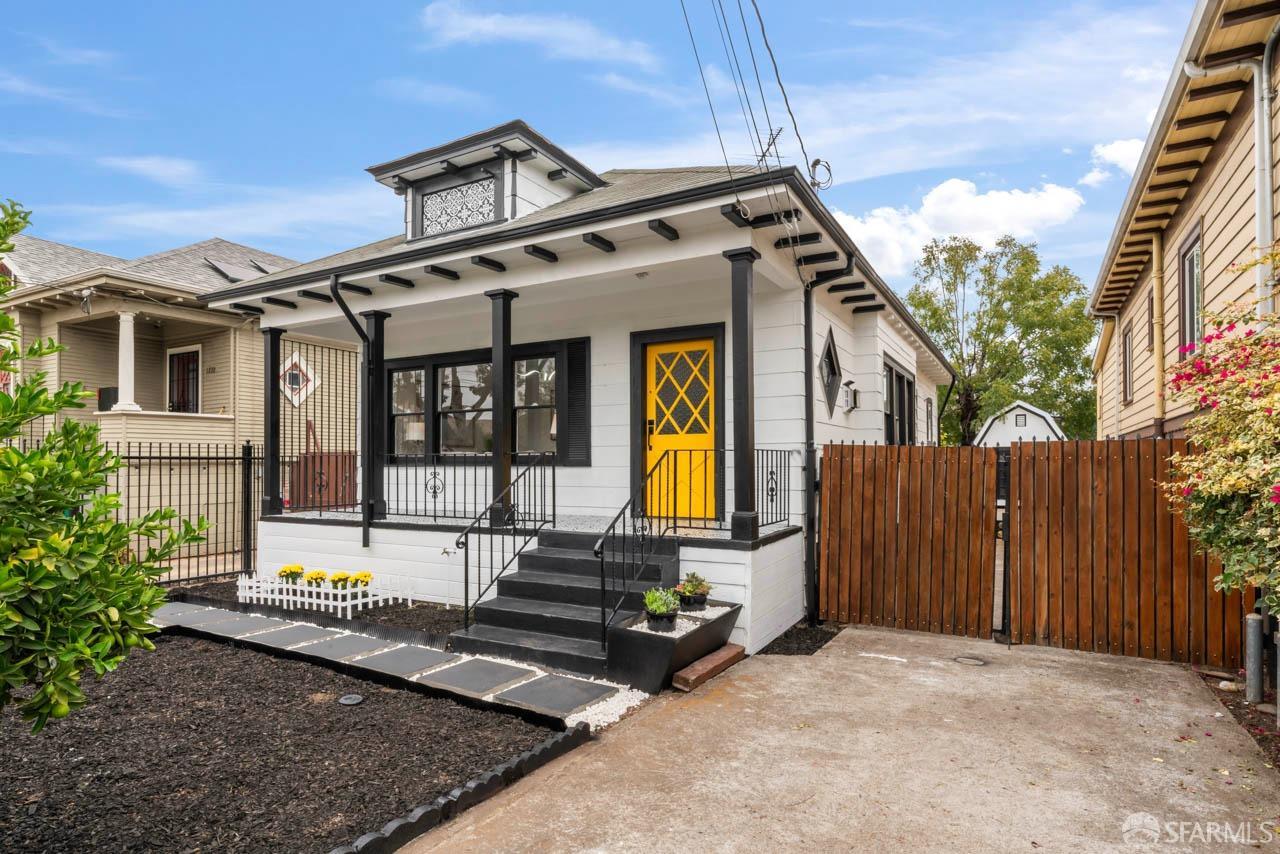 1718 37th Avenue Oakland, CA 94601 - Photo 2 of 33 a front view of a house with large windows