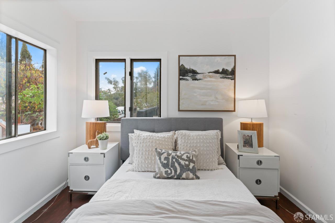 1718 37th Avenue Oakland, CA 94601 - Photo 25 of 33 a bedroom with a bed and a large window