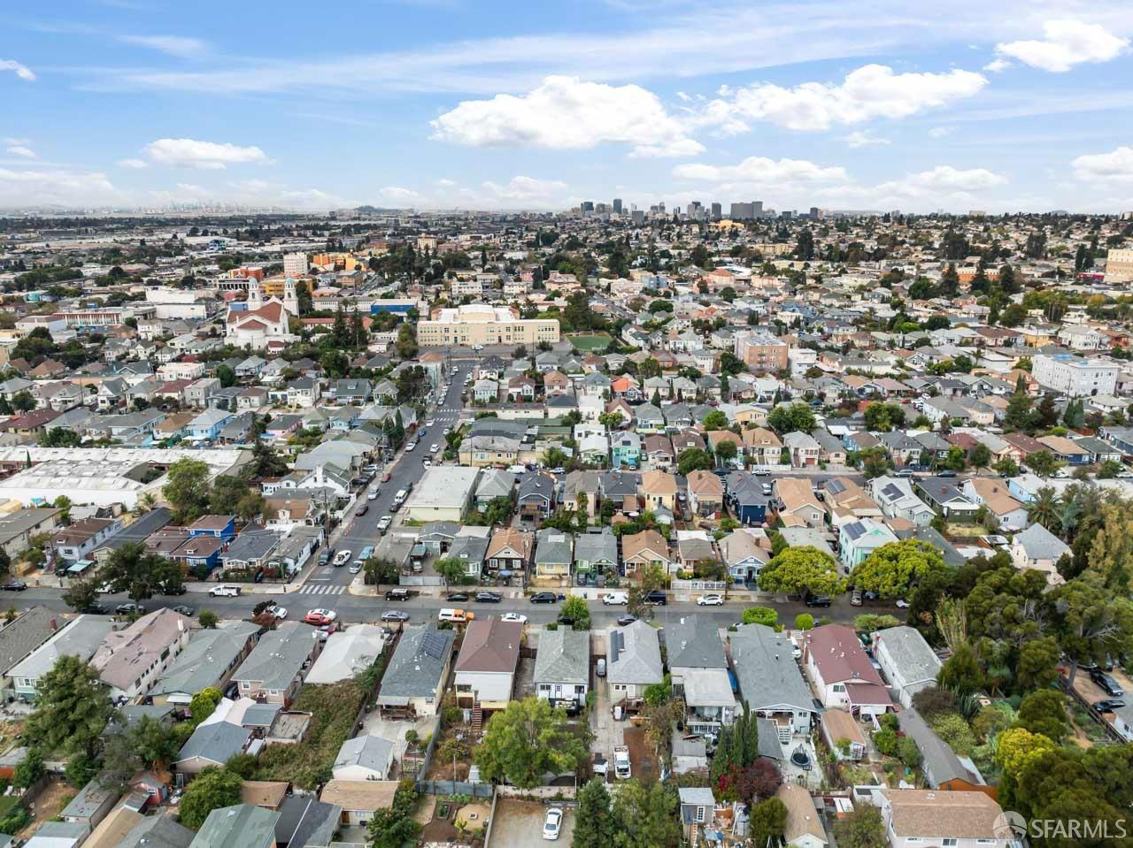 1718 37th Avenue Oakland, CA 94601 - Photo 6 of 33 an aerial view of residential houses with city view