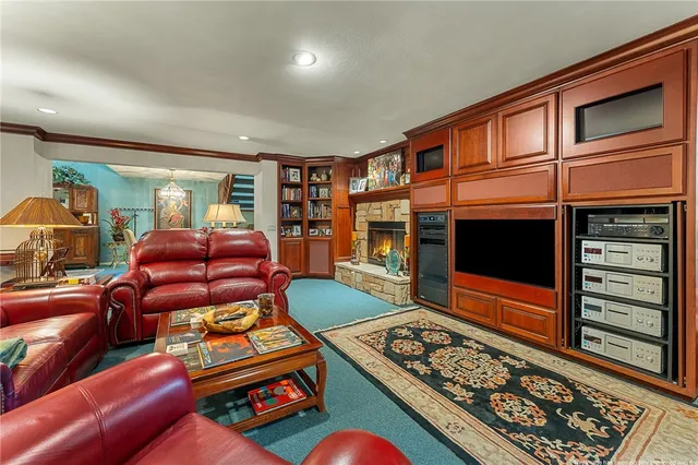 a view of a house with swimming pool and sitting area