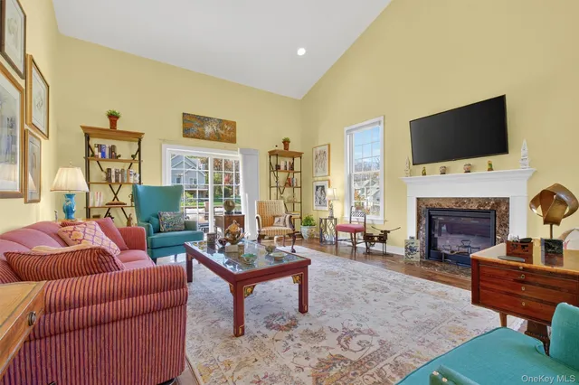 a living room with furniture fireplace and a flat screen tv