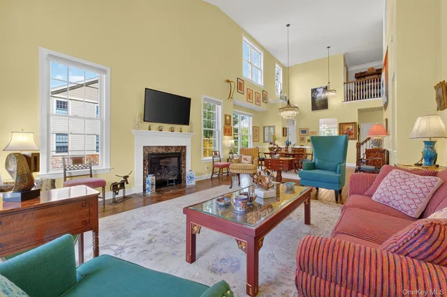 a living room with furniture fireplace and a flat screen tv