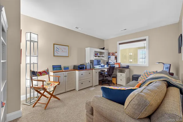 a bed room with furniture and a window