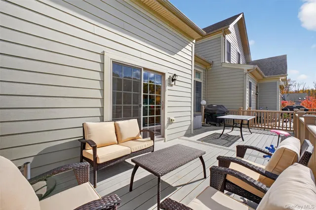 a view of a patio with couches chairs and a table