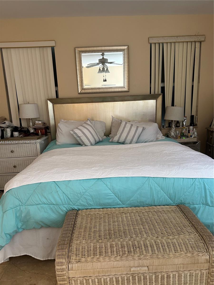 2501 Northeast 22nd Street Pompano Beach, FL 33062 - Photo 3 of 4 a bedroom with a bed and a night stand