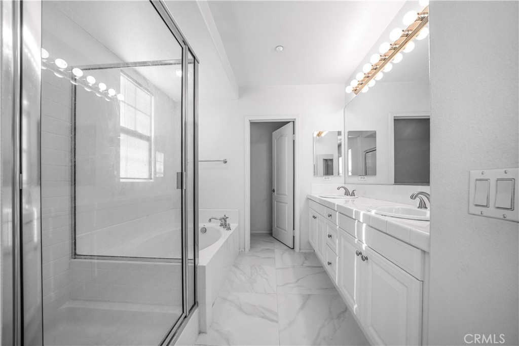 5 Arlington Street Ladera Ranch, CA 92694 - Photo 16 of 26 a spacious bathroom with a double vanity sink mirror and shower