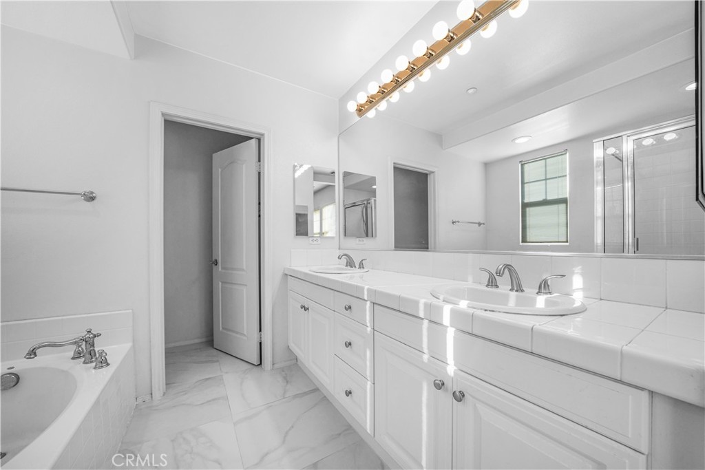 5 Arlington Street Ladera Ranch, CA 92694 - Photo 17 of 26 a bathroom with a granite countertop sink mirror and double