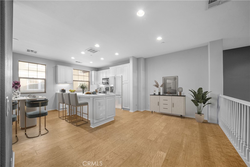 5 Arlington Street Ladera Ranch, CA 92694 - Photo 6 of 26 a large white room with kitchen view and a window