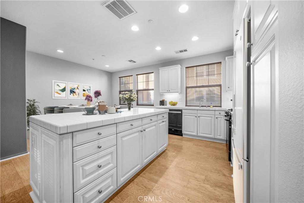 5 Arlington Street Ladera Ranch, CA 92694 - Photo 10 of 26 a kitchen with a sink window and cabinets