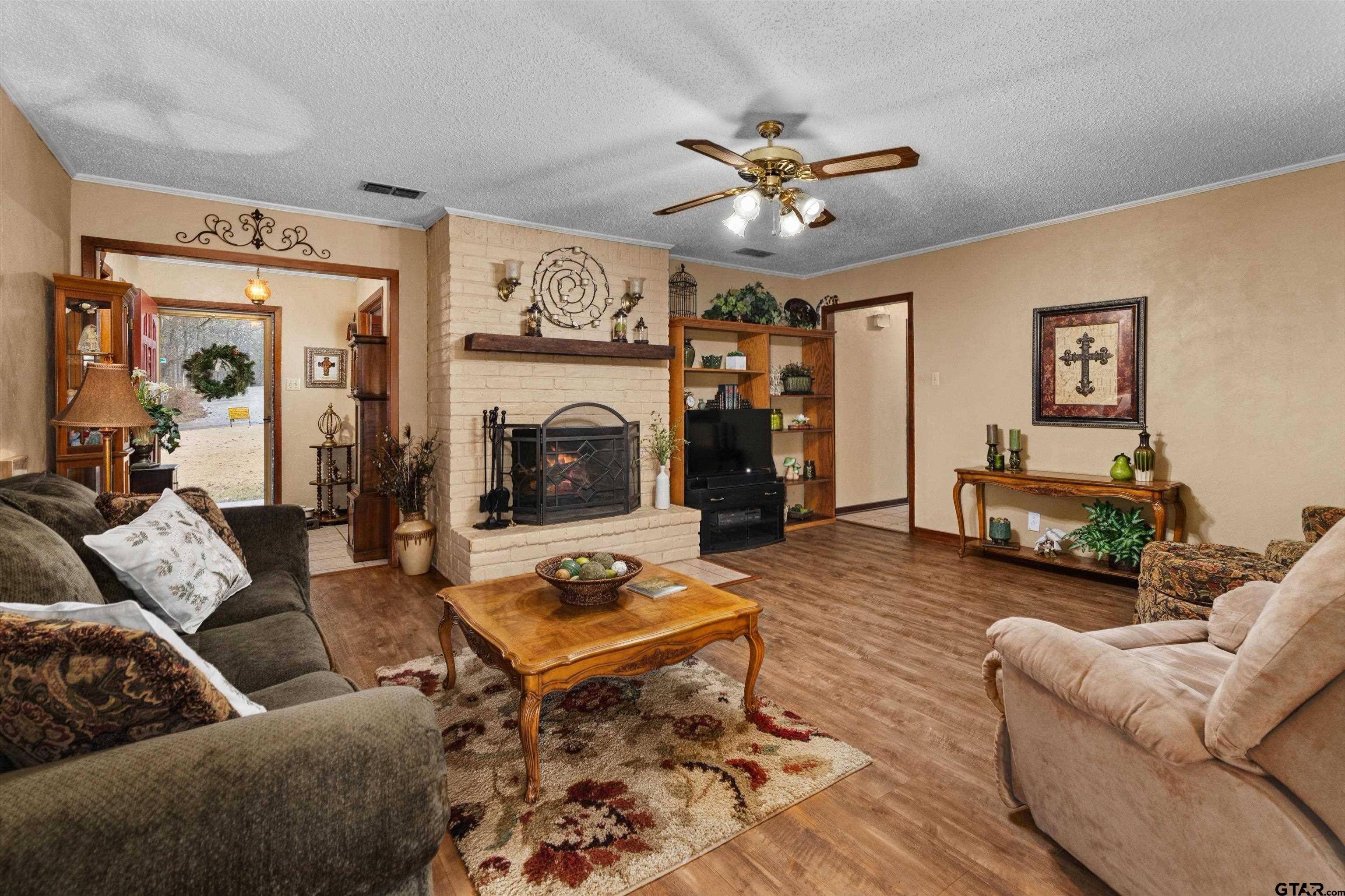 3501 Boyd Road Longview, TX 75604 - Photo 11 of 39 a living room with furniture and a fireplace