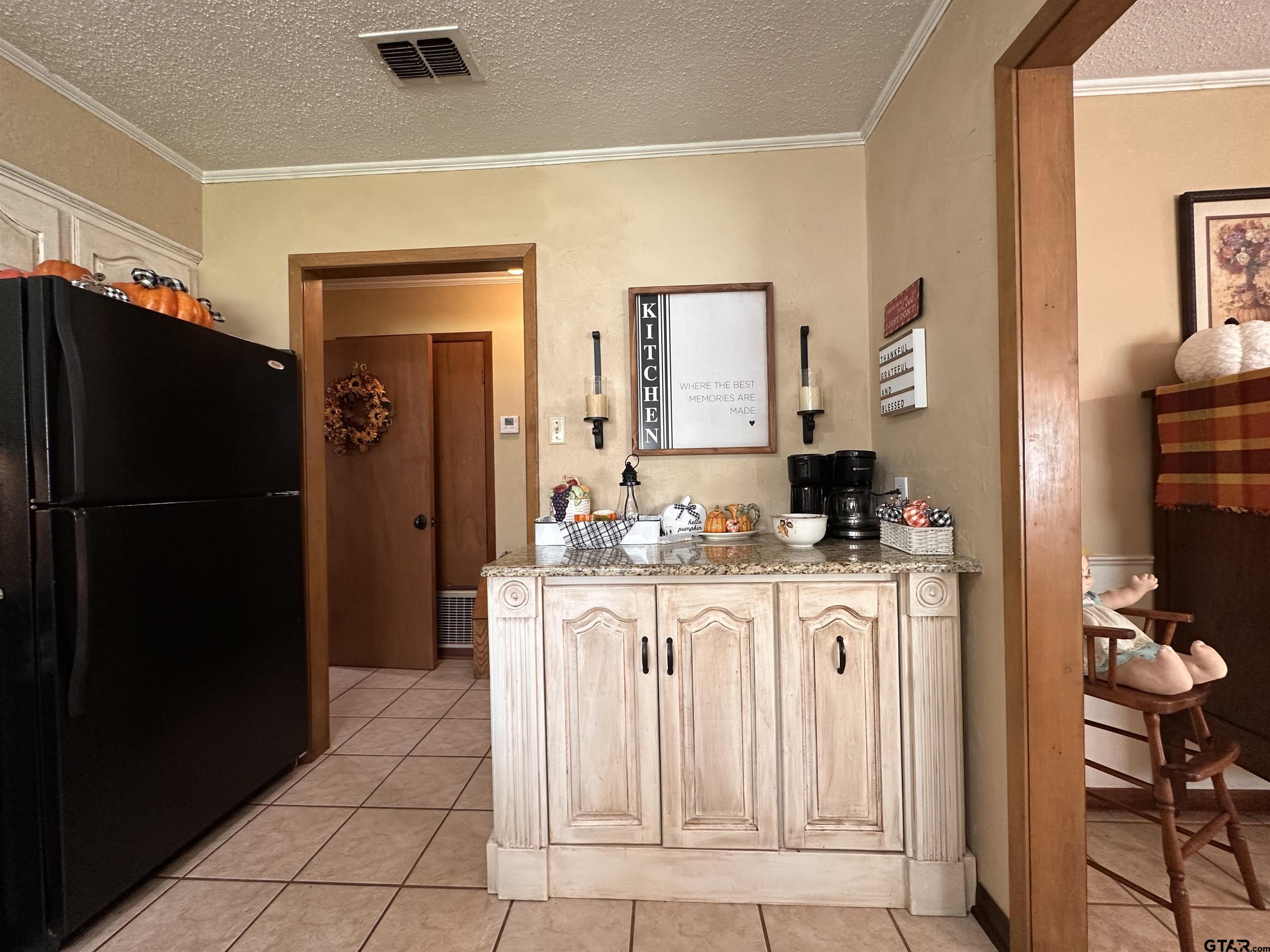 3501 Boyd Road Longview, TX 75604 - Photo 14 of 40 a kitchen with stainless steel appliances granite countertop a refrigerator and a stove