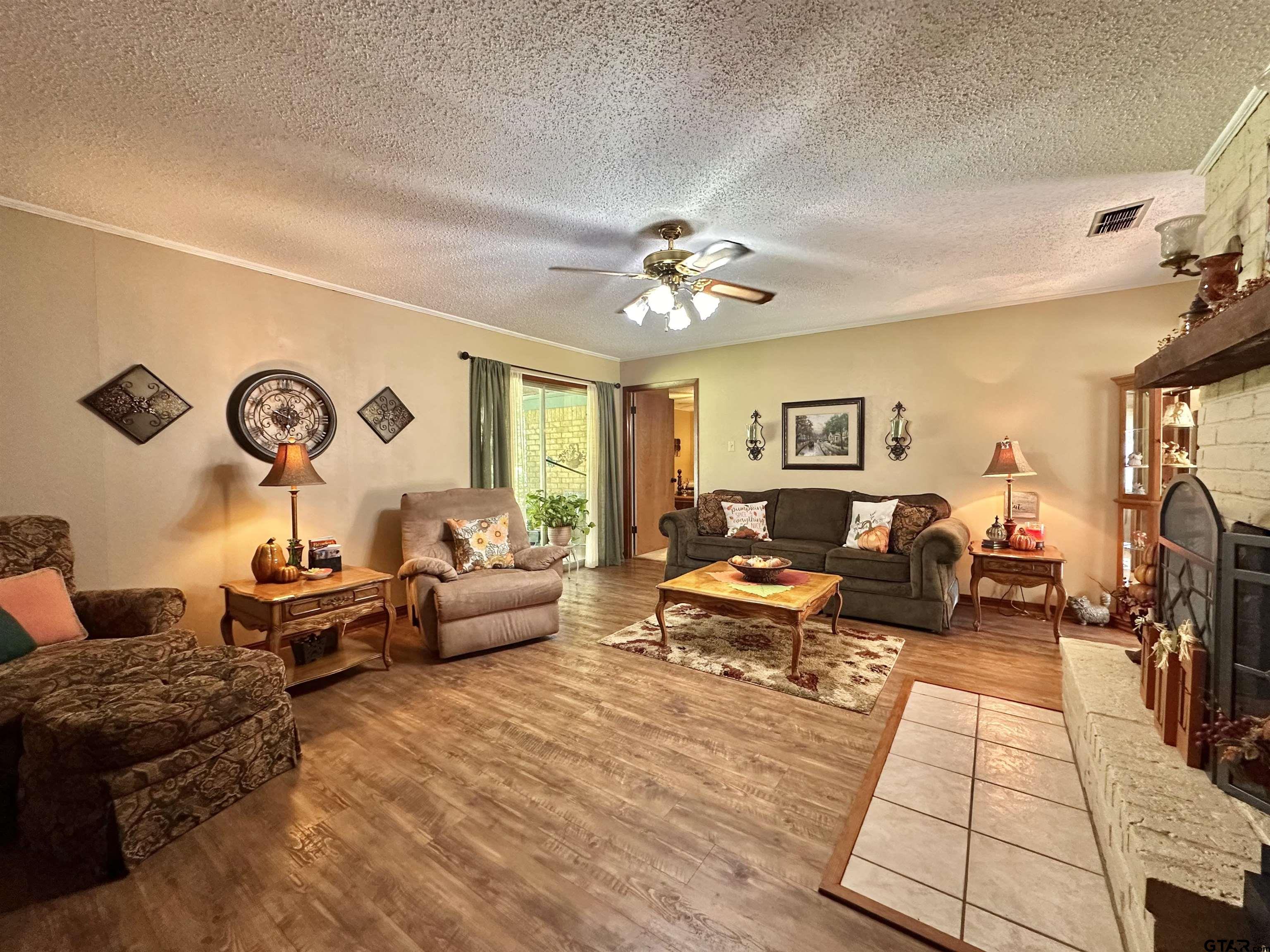 3501 Boyd Road Longview, TX 75604 - Photo 20 of 40 a living room with furniture and a large window