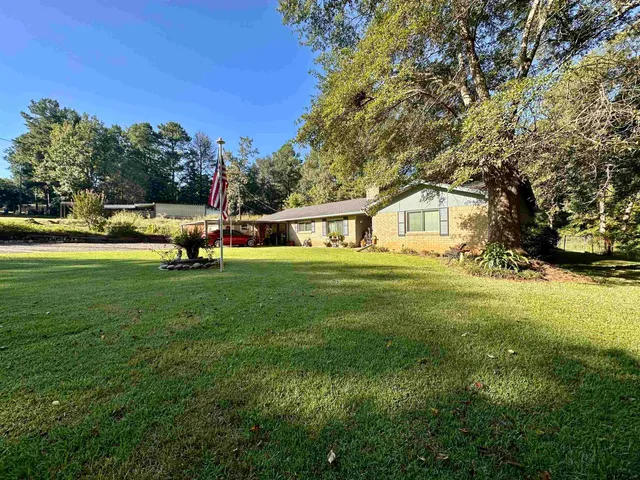 a view of house with outdoor space