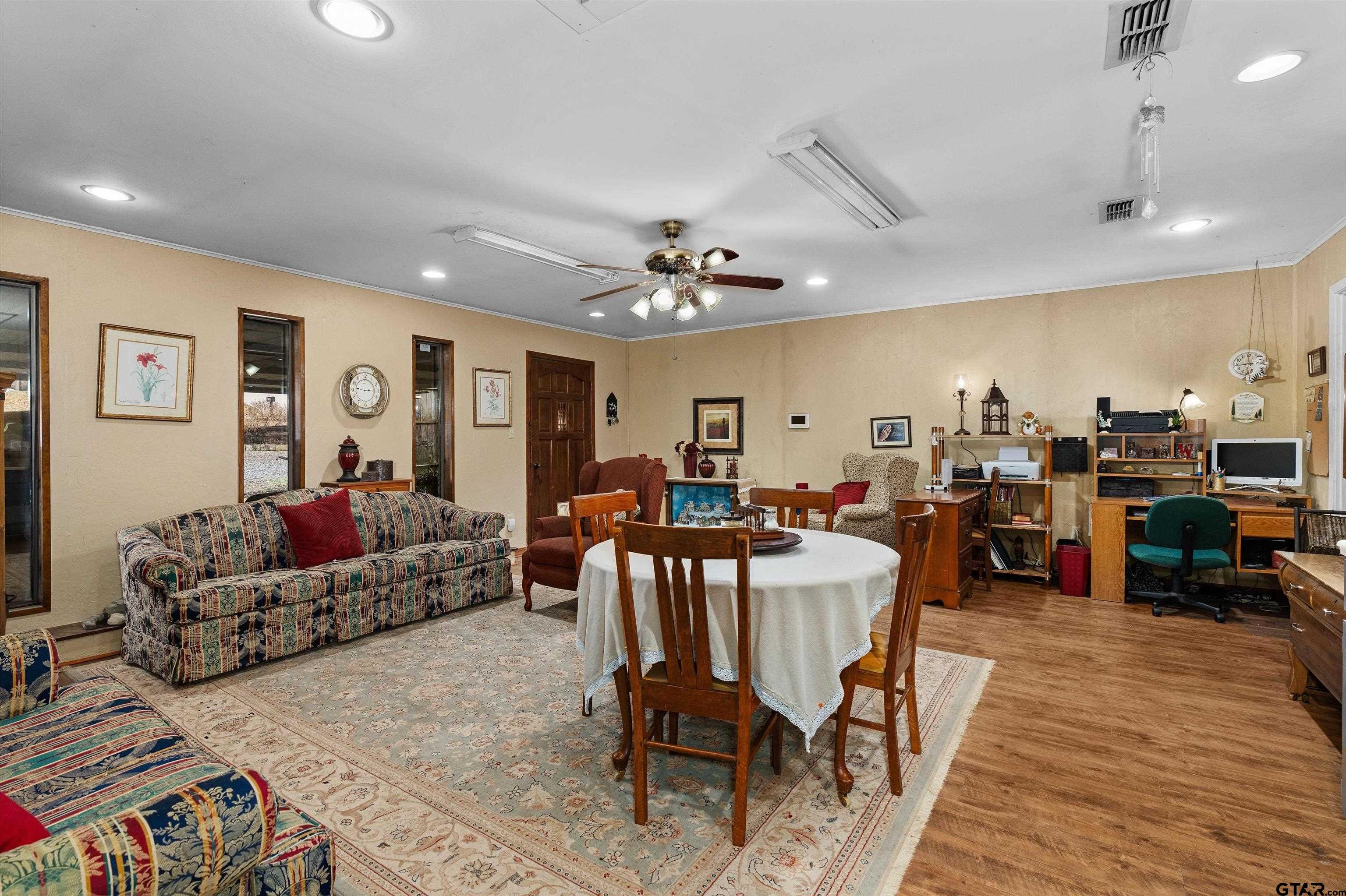 3501 Boyd Road Longview, TX 75604 - Photo 21 of 39 a living room with lots of furniture and wooden floor
