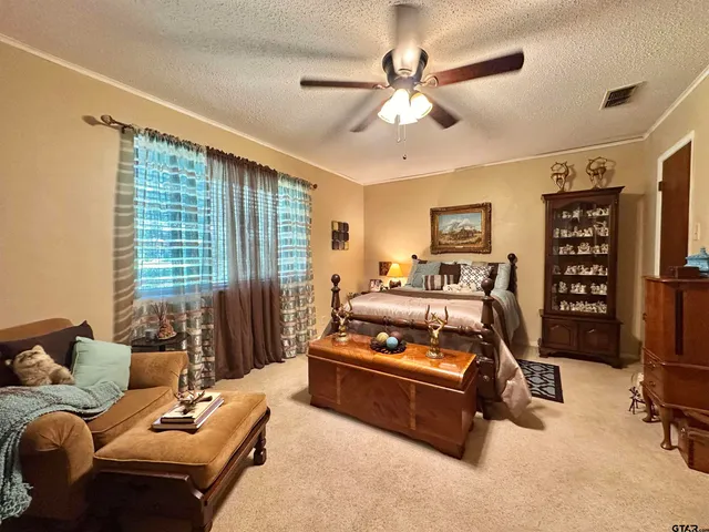a bedroom with furniture and a window