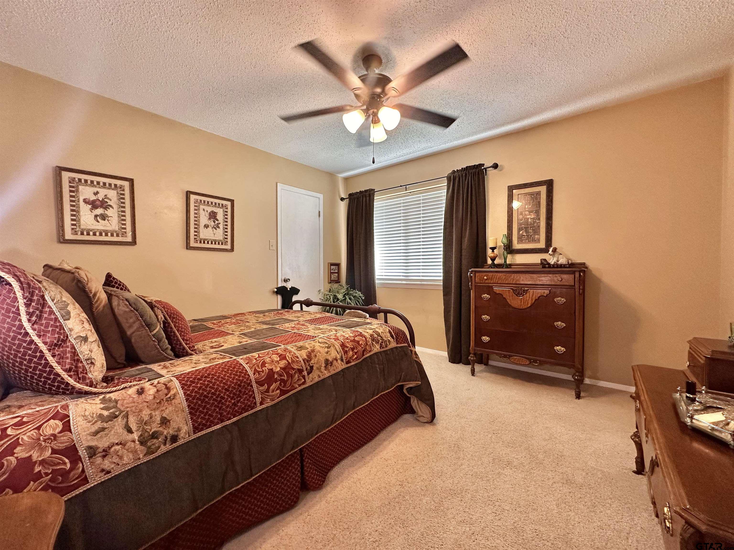 3501 Boyd Road Longview, TX 75604 - Photo 28 of 40 a bed room with a bed and dresser