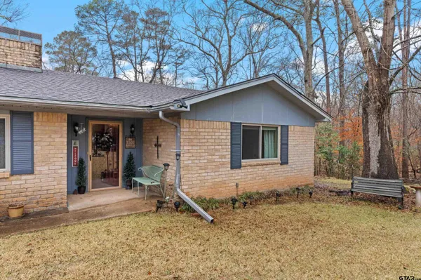 a house with trees in the background