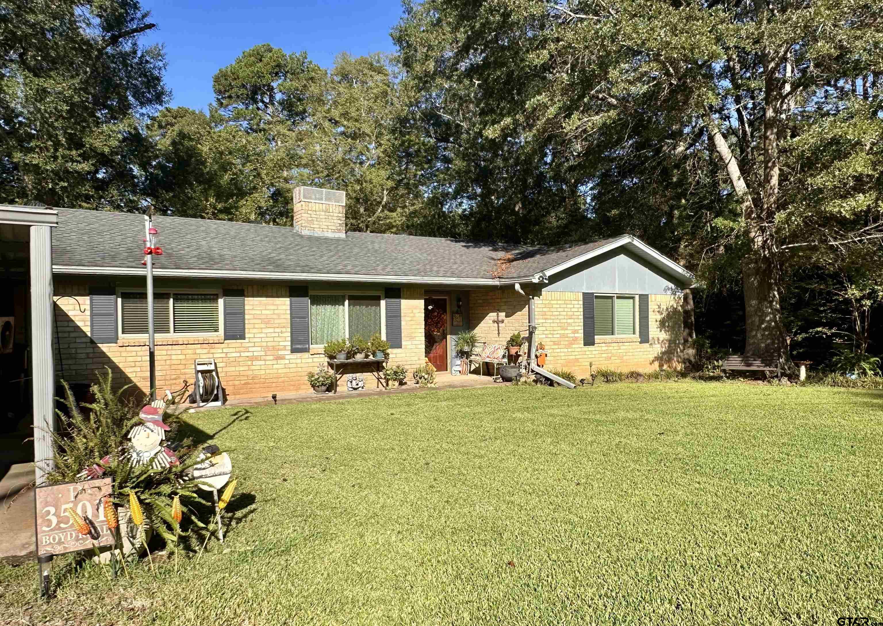 3501 Boyd Road Longview, TX 75604 - Photo 3 of 40 a view of swimming pool with table and chairs under an umbrella