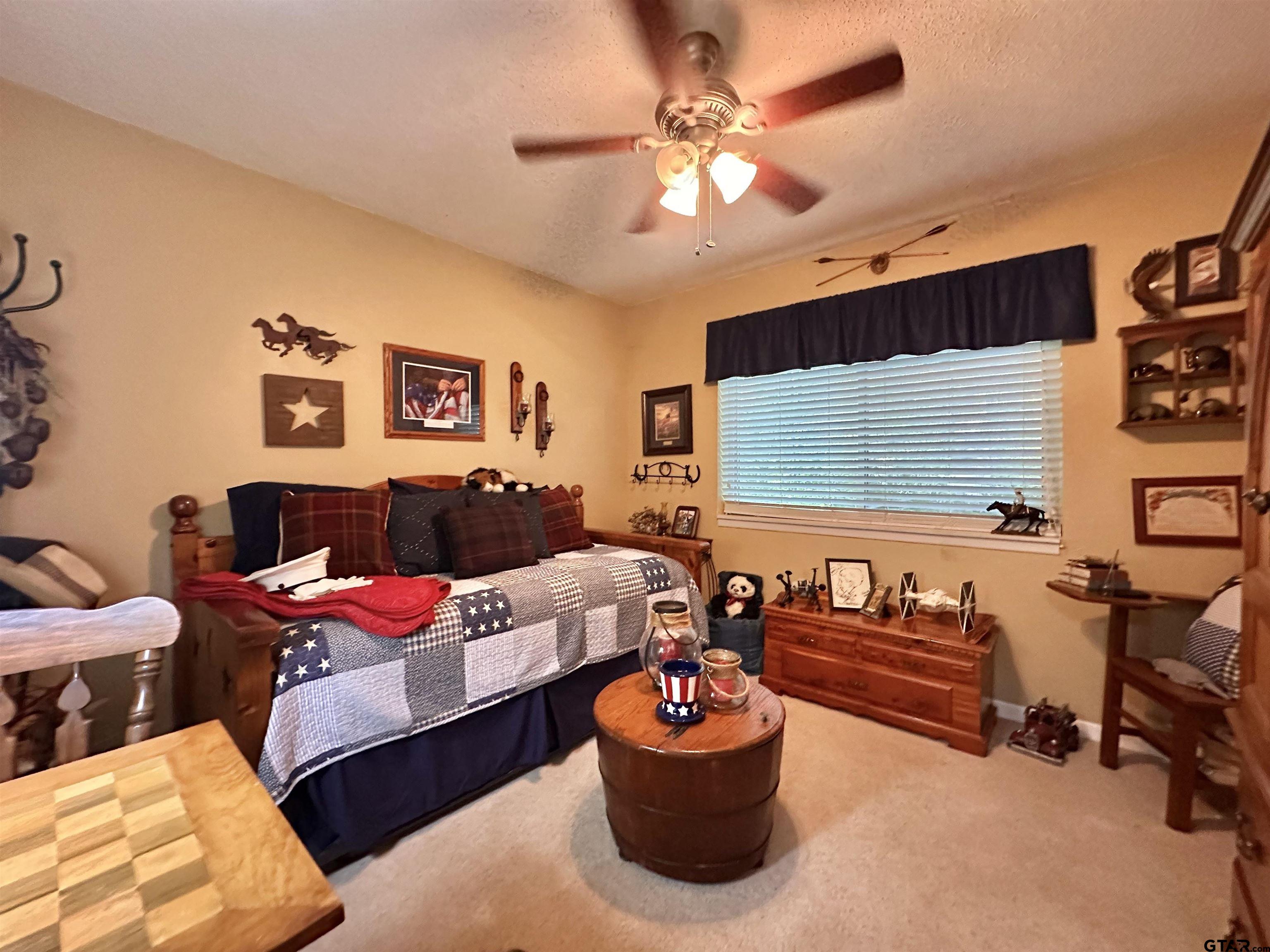 3501 Boyd Road Longview, TX 75604 - Photo 31 of 40 a living room with furniture and a flat screen tv