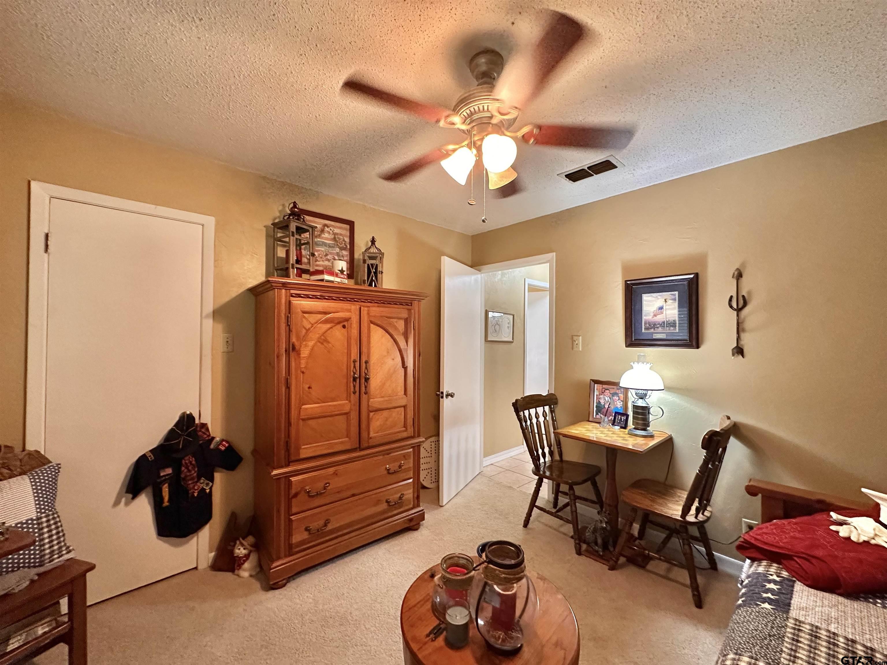 3501 Boyd Road Longview, TX 75604 - Photo 32 of 40 a view of a workspace with furniture and a window