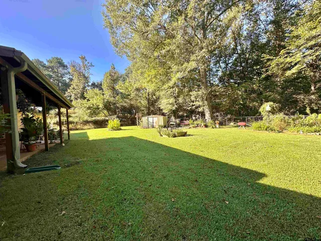 a view of yard with swimming pool