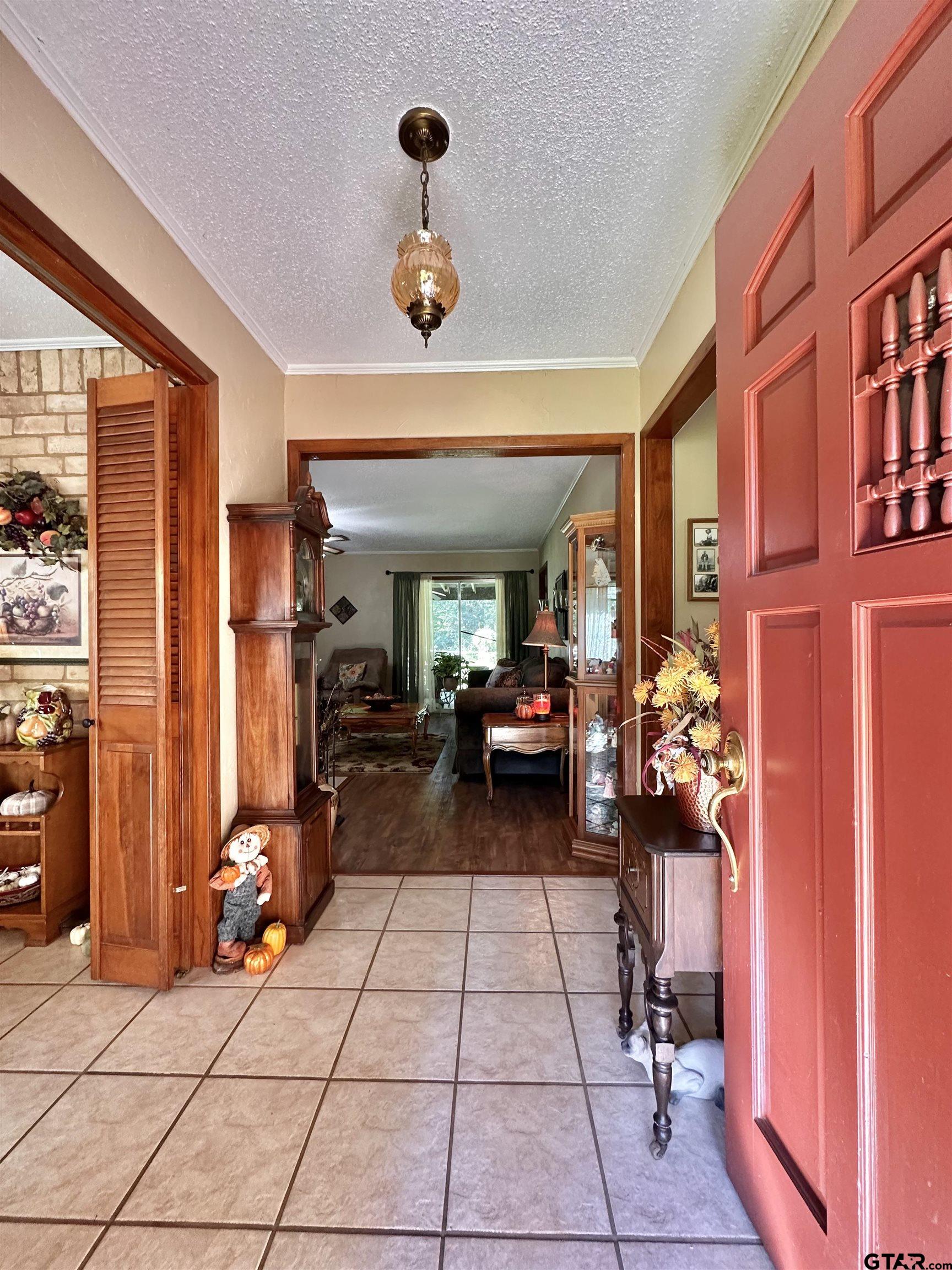 3501 Boyd Road Longview, TX 75604 - Photo 5 of 40 a living room with furniture a dining table and a large window