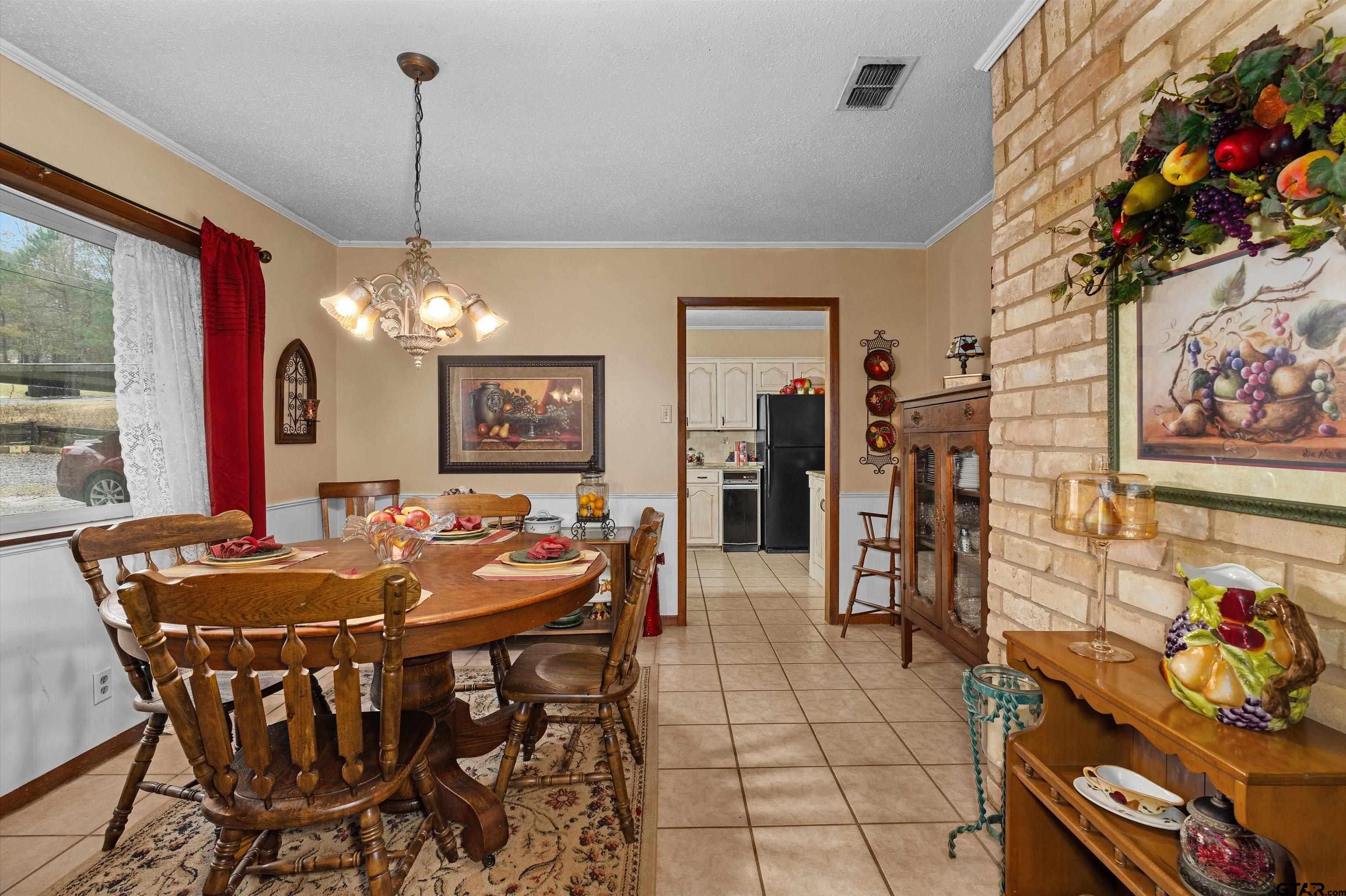 3501 Boyd Road Longview, TX 75604 - Photo 5 of 39 a view of a dining room with furniture and chandelier