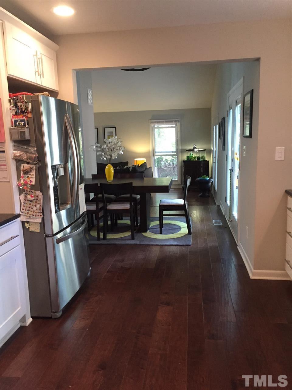 5400 Sylvan Lane Raleigh, NC 27613 - Photo 12 of 24 a kitchen with stainless steel appliances granite countertop a refrigerator and a stove