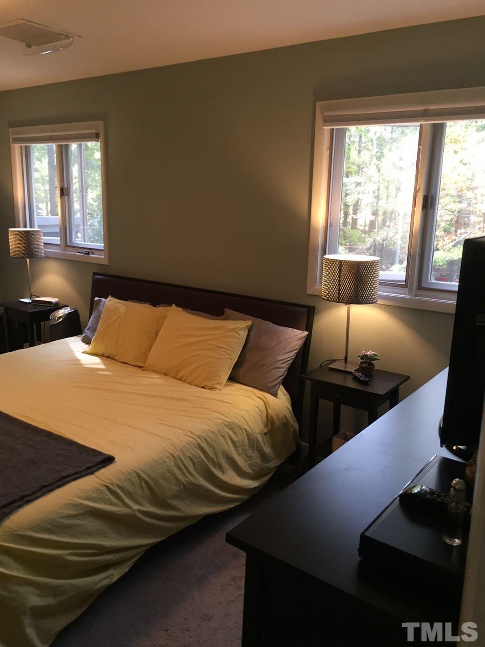 5400 Sylvan Lane Raleigh, NC 27613 - Photo 18 of 24 a bedroom with a bed and window