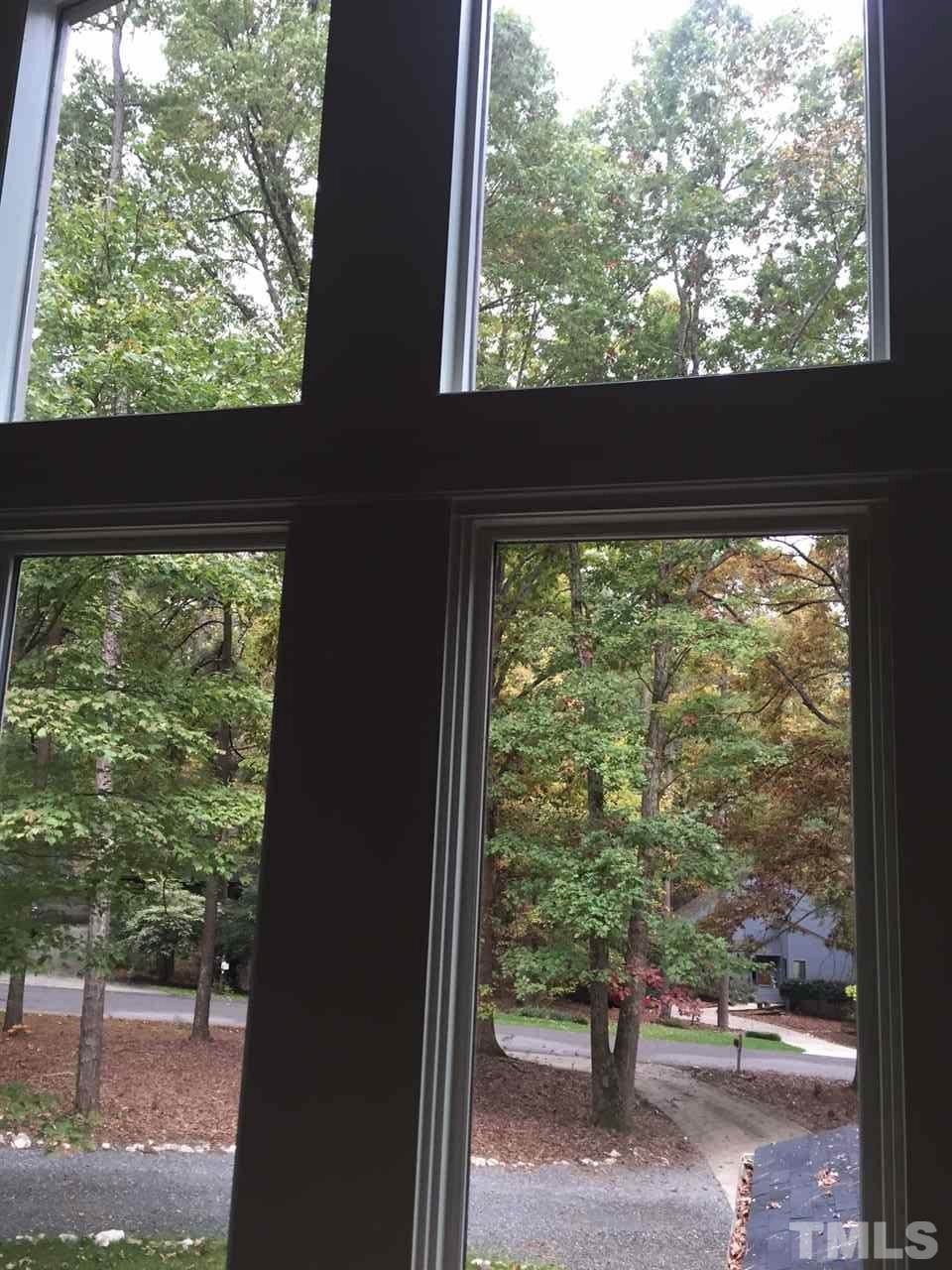 5400 Sylvan Lane Raleigh, NC 27613 - Photo 24 of 24 a view of two trees from a window
