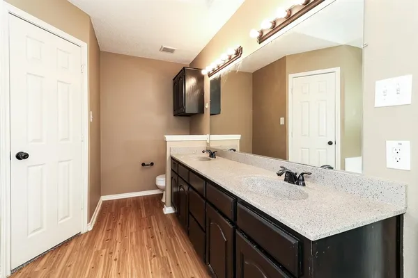 a bathroom with a sink and mirror