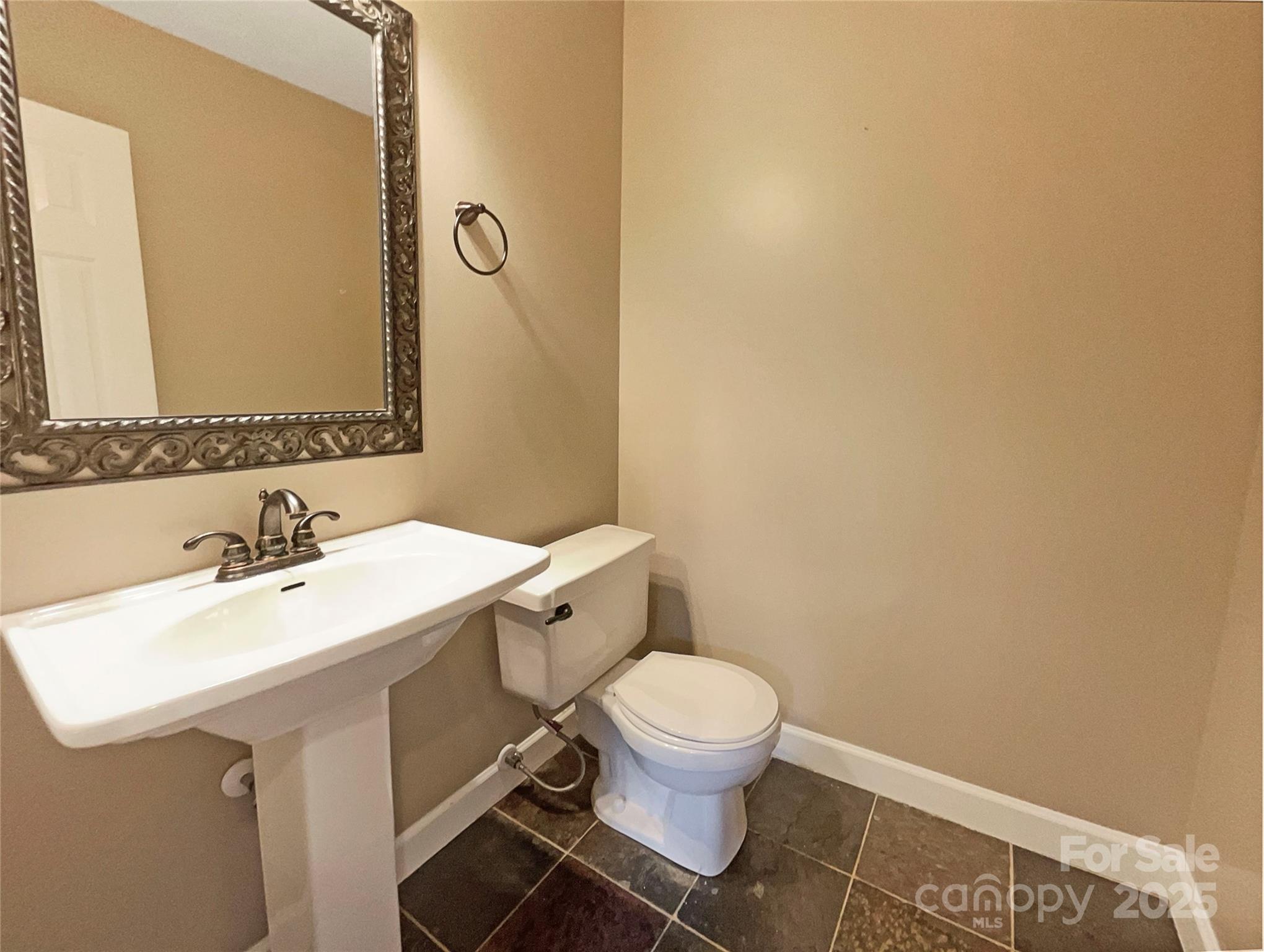 12092 Spinnaker Drive Fort Mill, SC 29708 - Photo 14 of 20 a bathroom with a sink mirror vanity and toilet