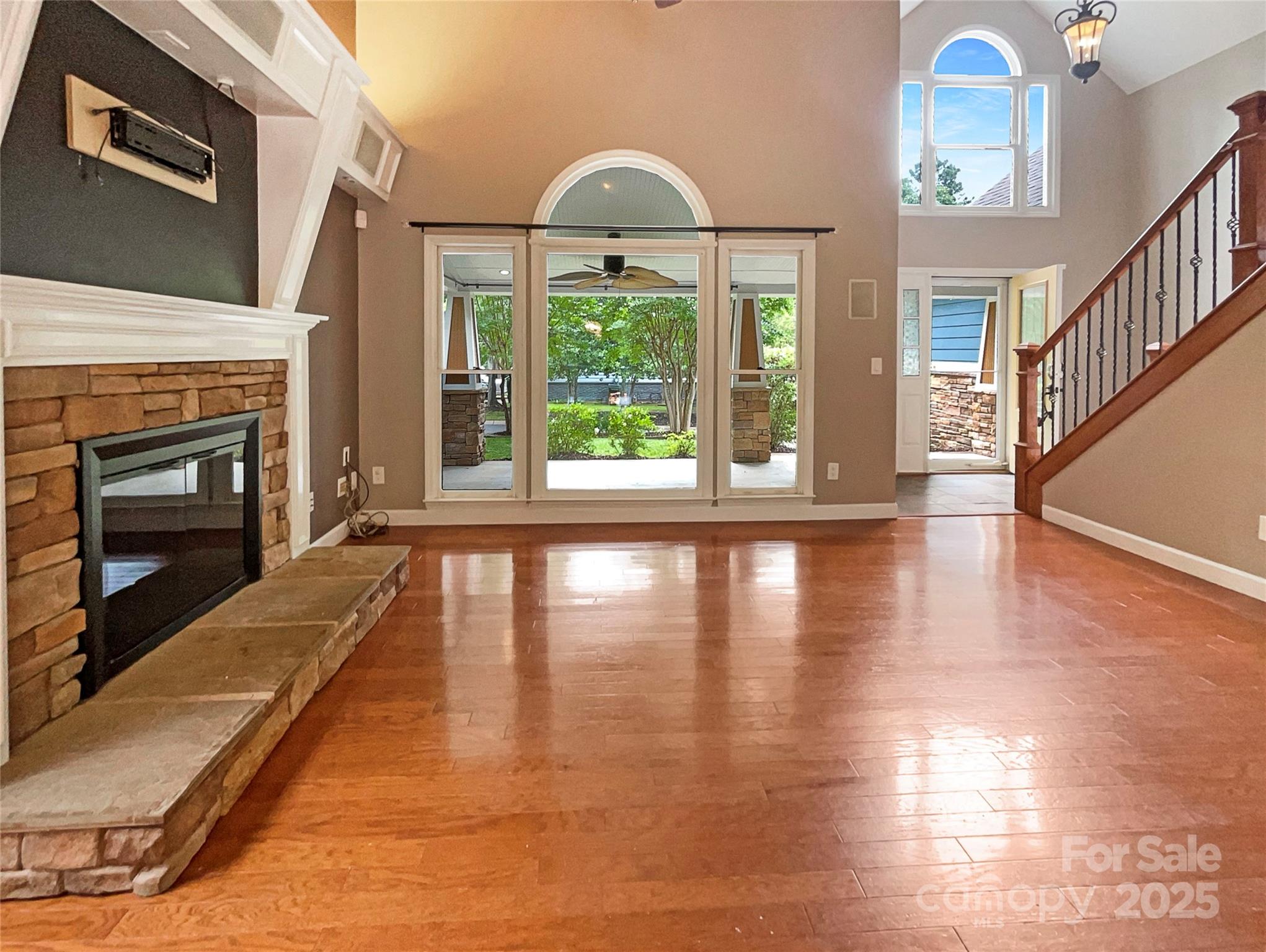 12092 Spinnaker Drive Fort Mill, SC 29708 - Photo 3 of 20 a view of an empty room with wooden floor fireplace and a window